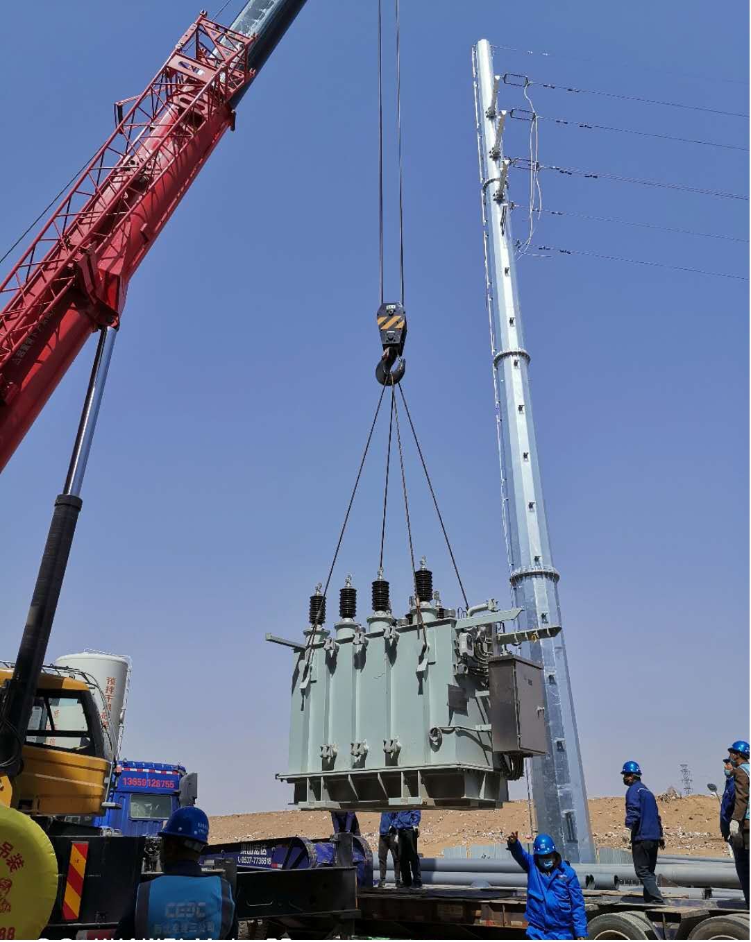 1587099274866736RJZf.jpg 國(guó)源公司榆林生活垃圾發(fā)電項(xiàng)目主變壓器成功就位 (1).jpg